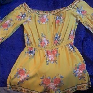 An off the shoulder romper